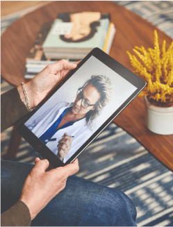 patient using a tablet to have a video call with a sollis doctor